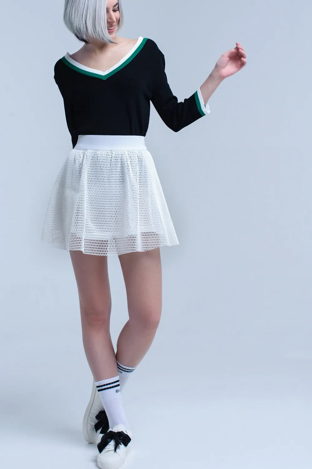 Black V-neck jersey with green and white contrast trim