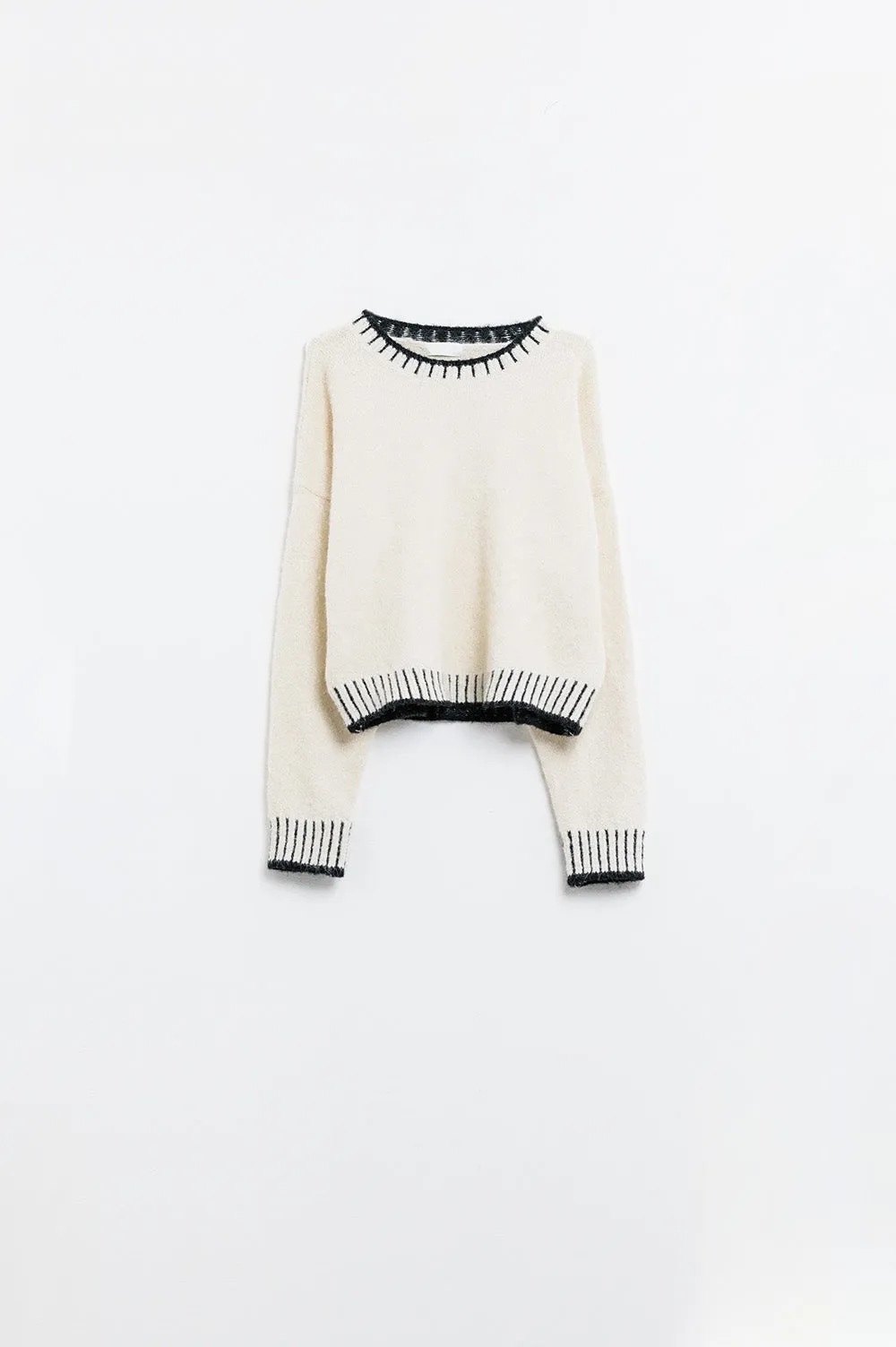Fluffy cream sweater with ribbed detail at neck and hem