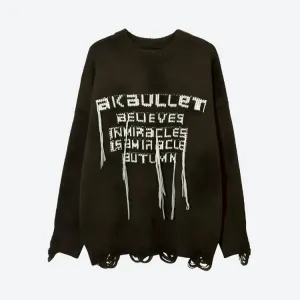Grunge-Inspired Sweater with Distressed Details and Pink Accents