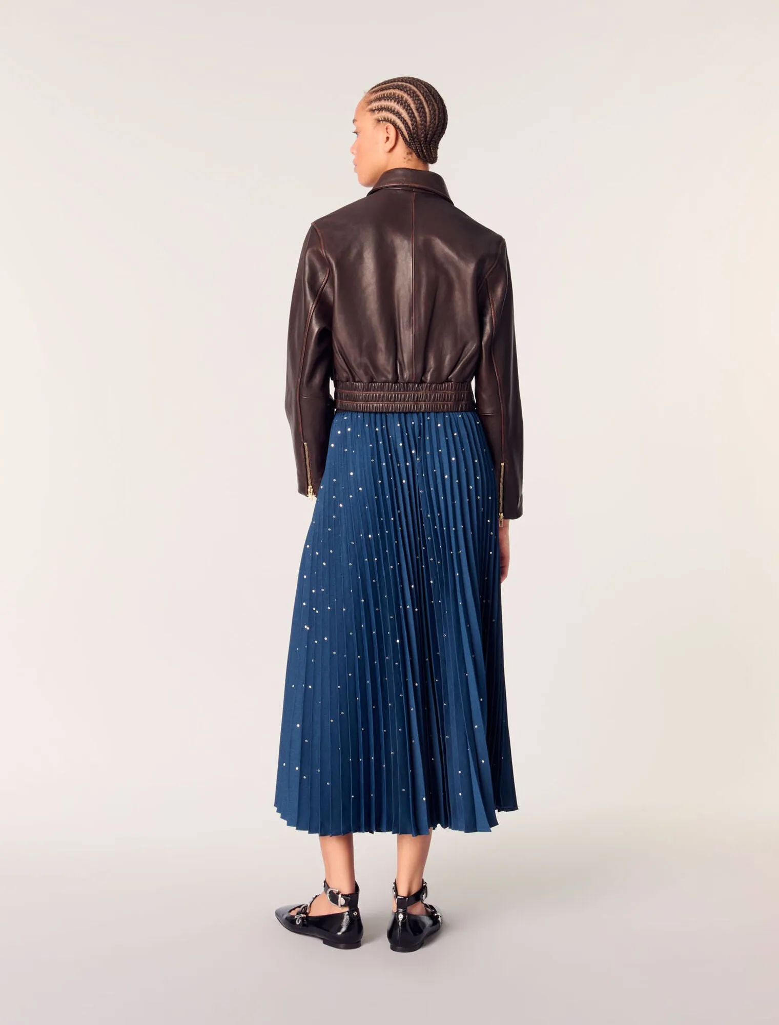 Long pleated skirt with studs