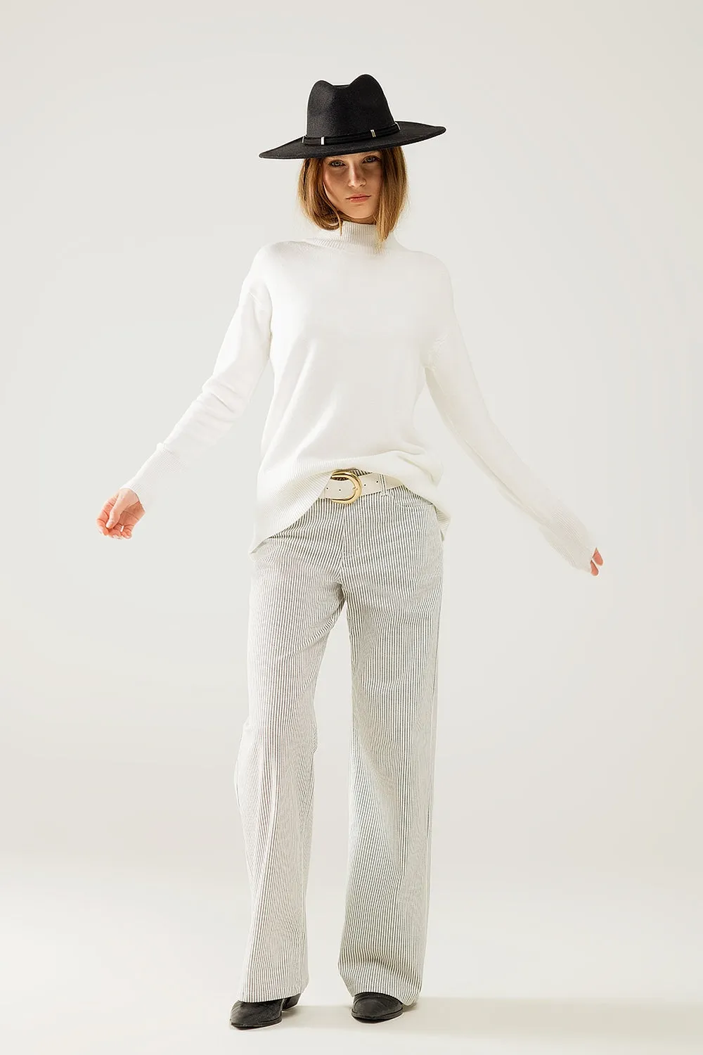 Loose white sweater with open back detail