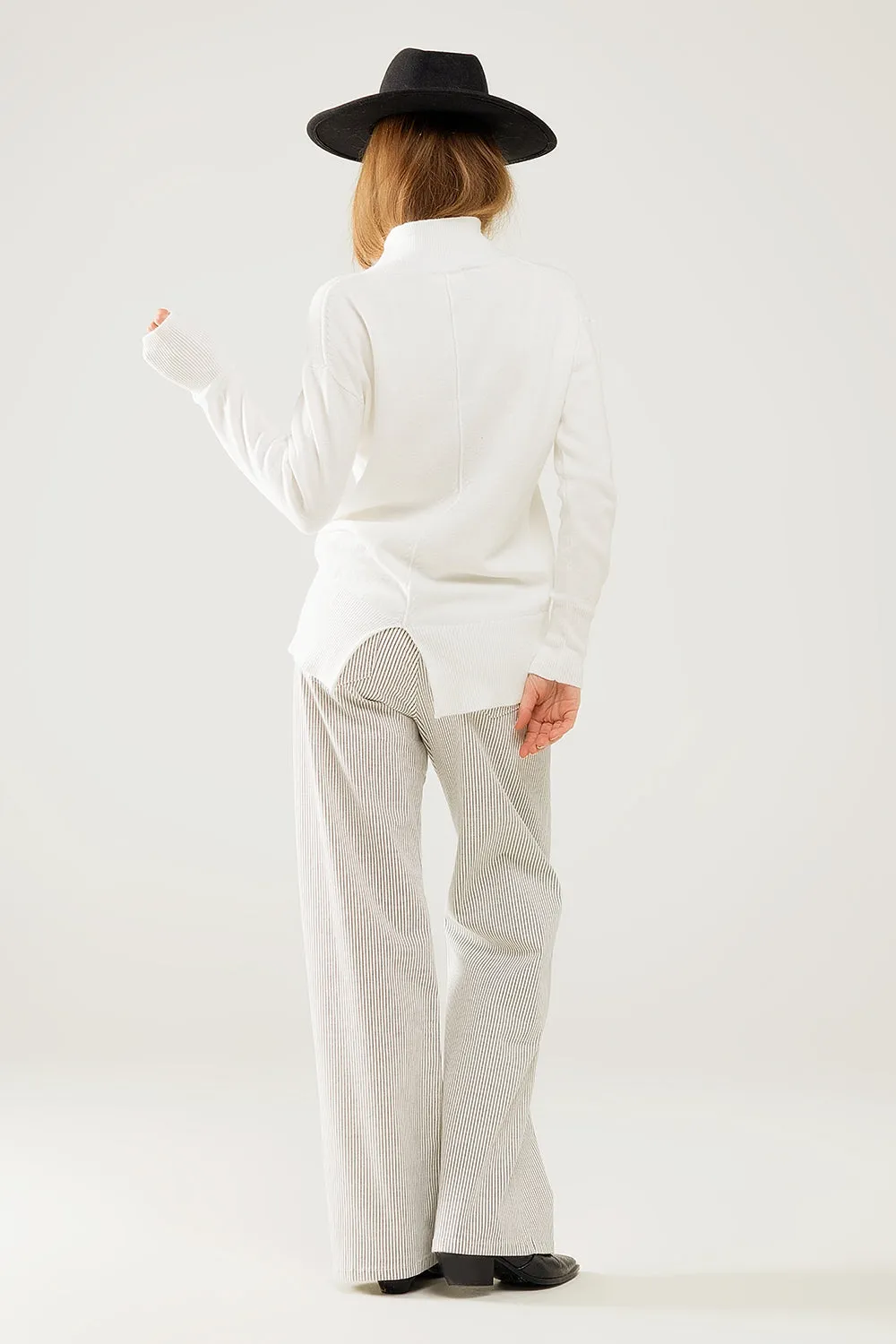 Loose white sweater with open back detail