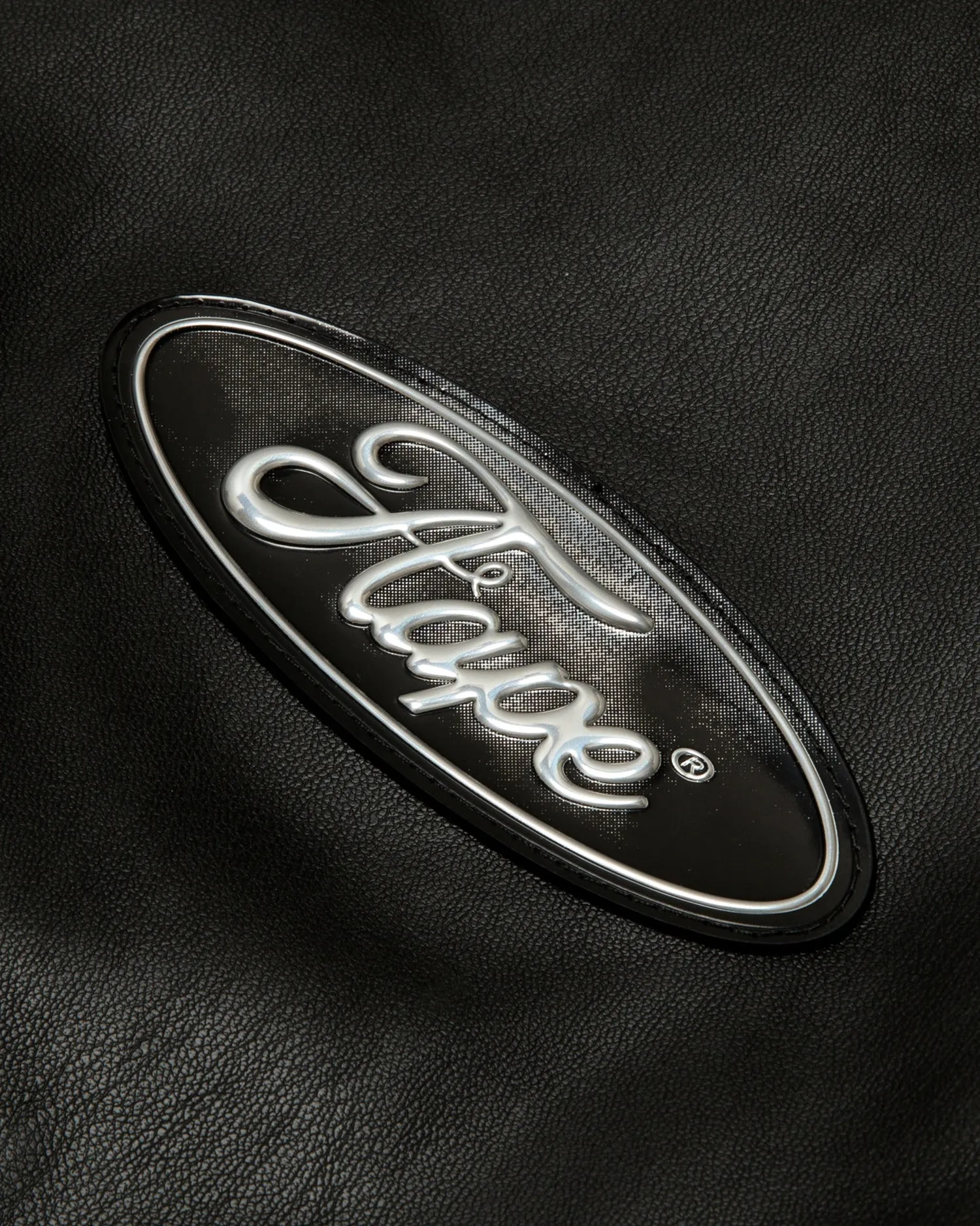 Moonface logo faux leather hooded jacket