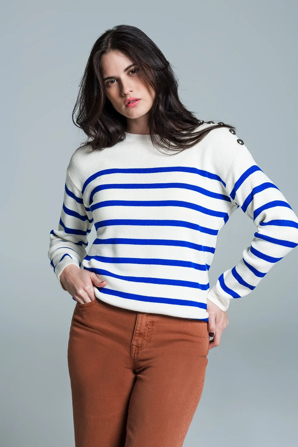 White sweater with buttons on shoulders and blue stripes